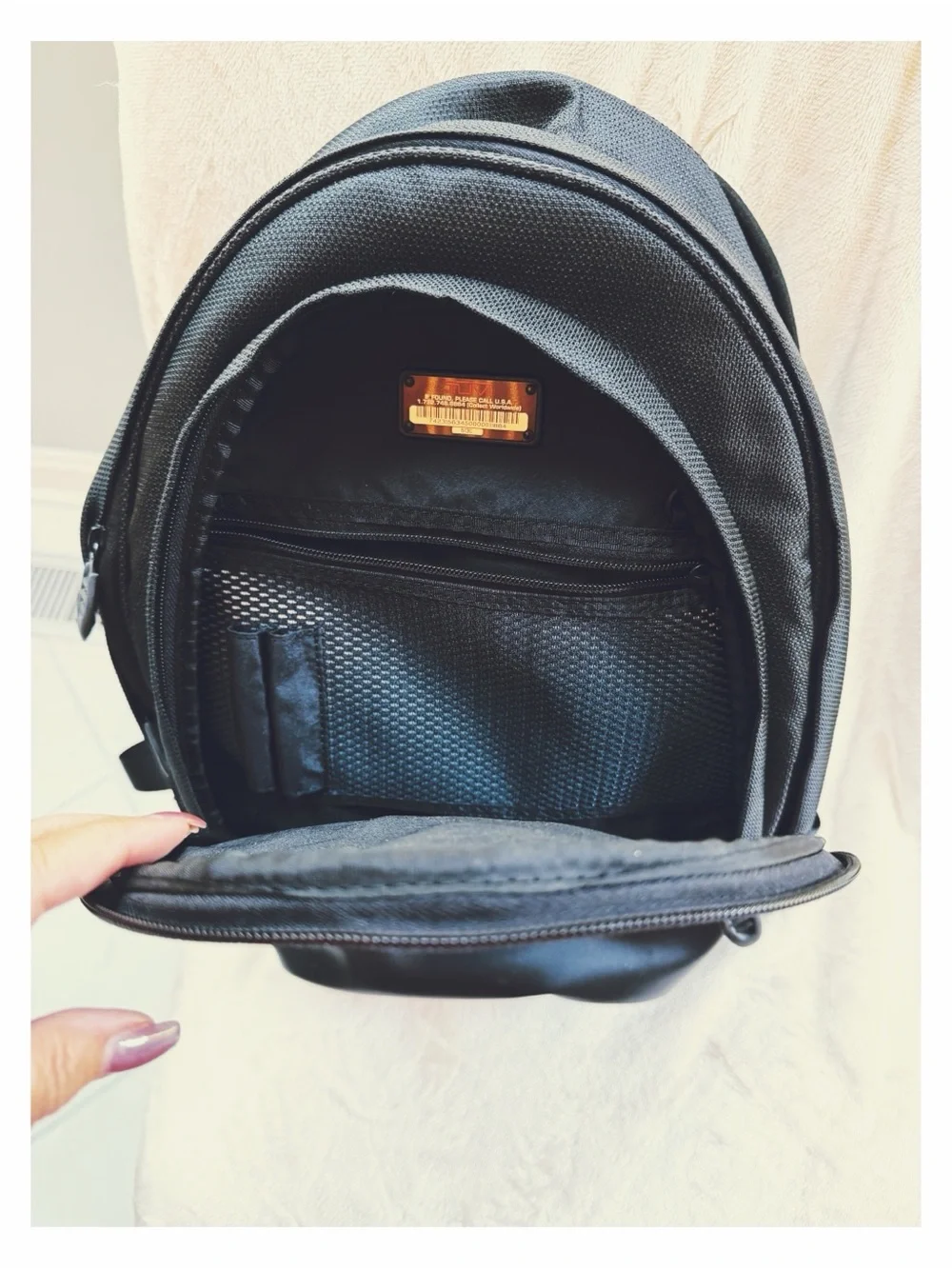 Tumi Black Backpack for Men or Women with Red Logo Accent